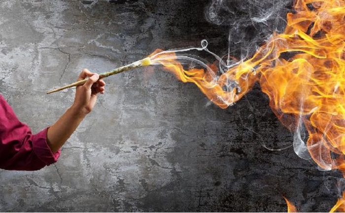 hand with fire stick